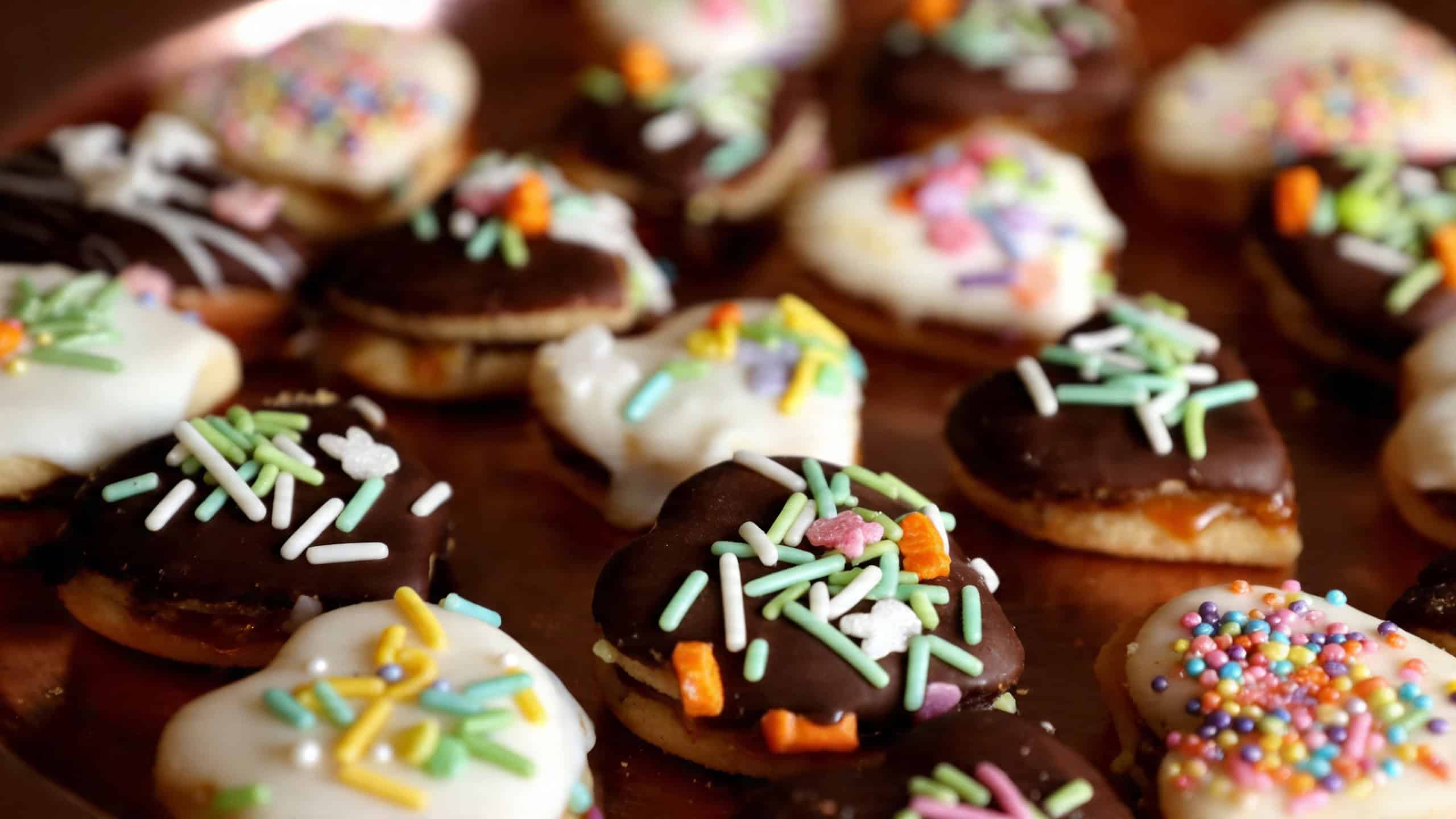 Chocolate-dipped alfajores finished with delicate sprinkles